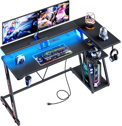 Korfile Reversible Gaming Desk with Power Outlet & LED Lights, Corner Computer Desk with 3 Tiers Storage Shelves, Home Office Desk with Monitor Stand for Small Space, 47 Inch Carbon Fiber Black